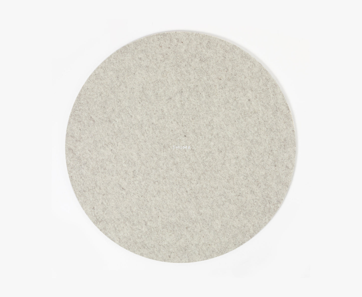 The Felt Tops is a round, light gray felt mat with a subtle texture, displayed on a plain white background. THUMA is faintly visible at the center.