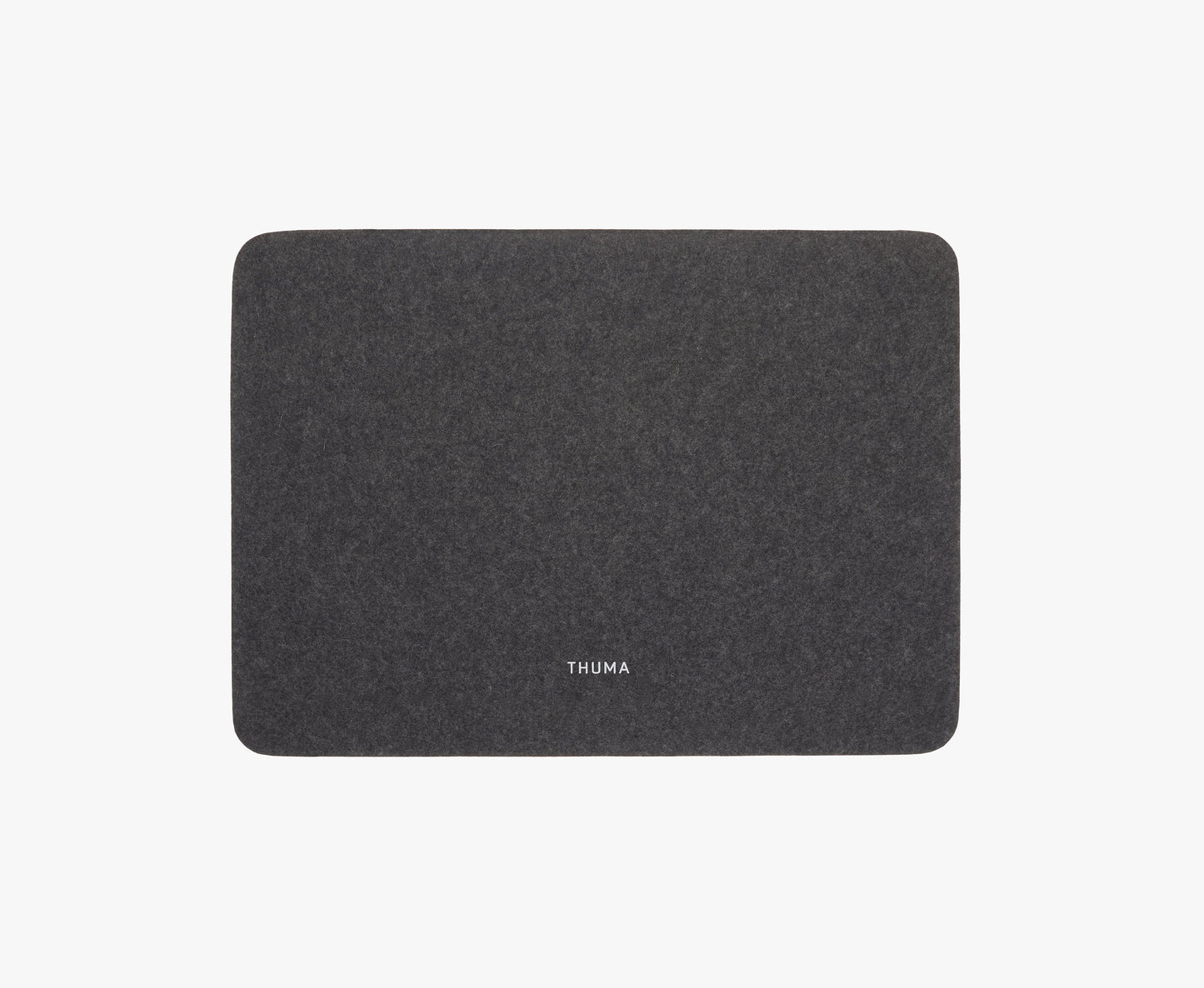 A rectangular dark gray Felt Tops mat with rounded corners and THUMA in white at the center, shown on a plain white background.