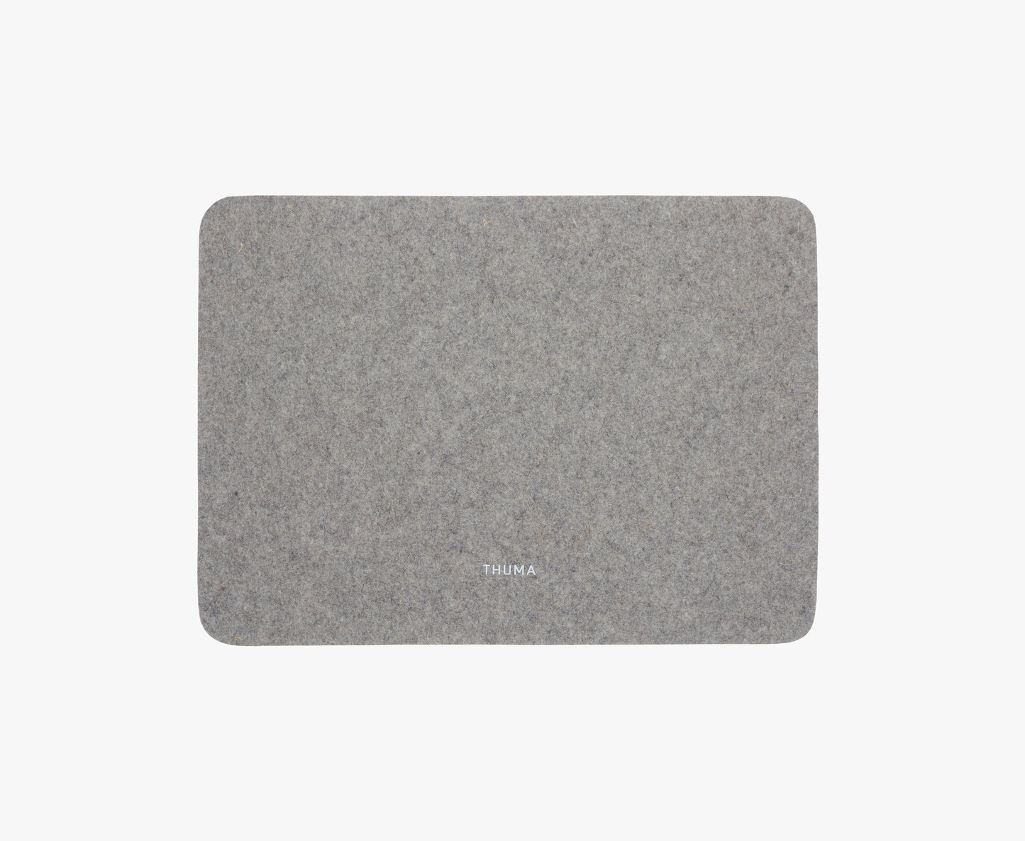 The Felt Tops is a rectangular grey felt mat with rounded corners and THUMA printed in small white letters near the bottom center, displayed on a plain white background.