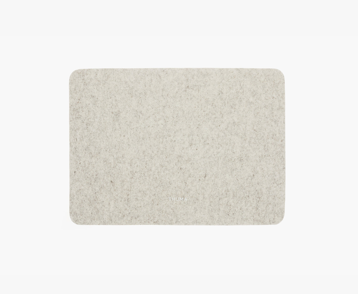 A rectangular, light gray Felt Tops desk pad with rounded corners sits on a white background. “HUM” is subtly printed near the bottom center of the pad.