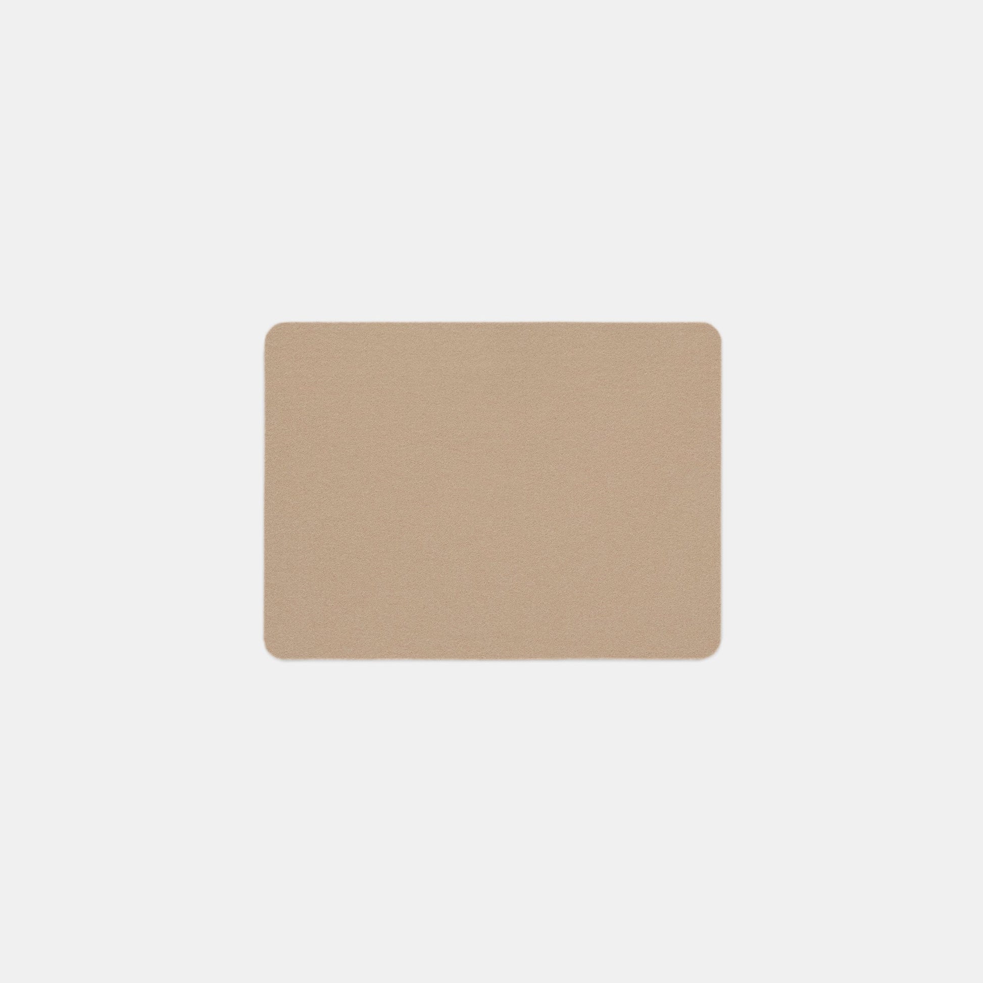 A rectangular beige Felt Tops mat with rounded corners is centered on a plain white background.