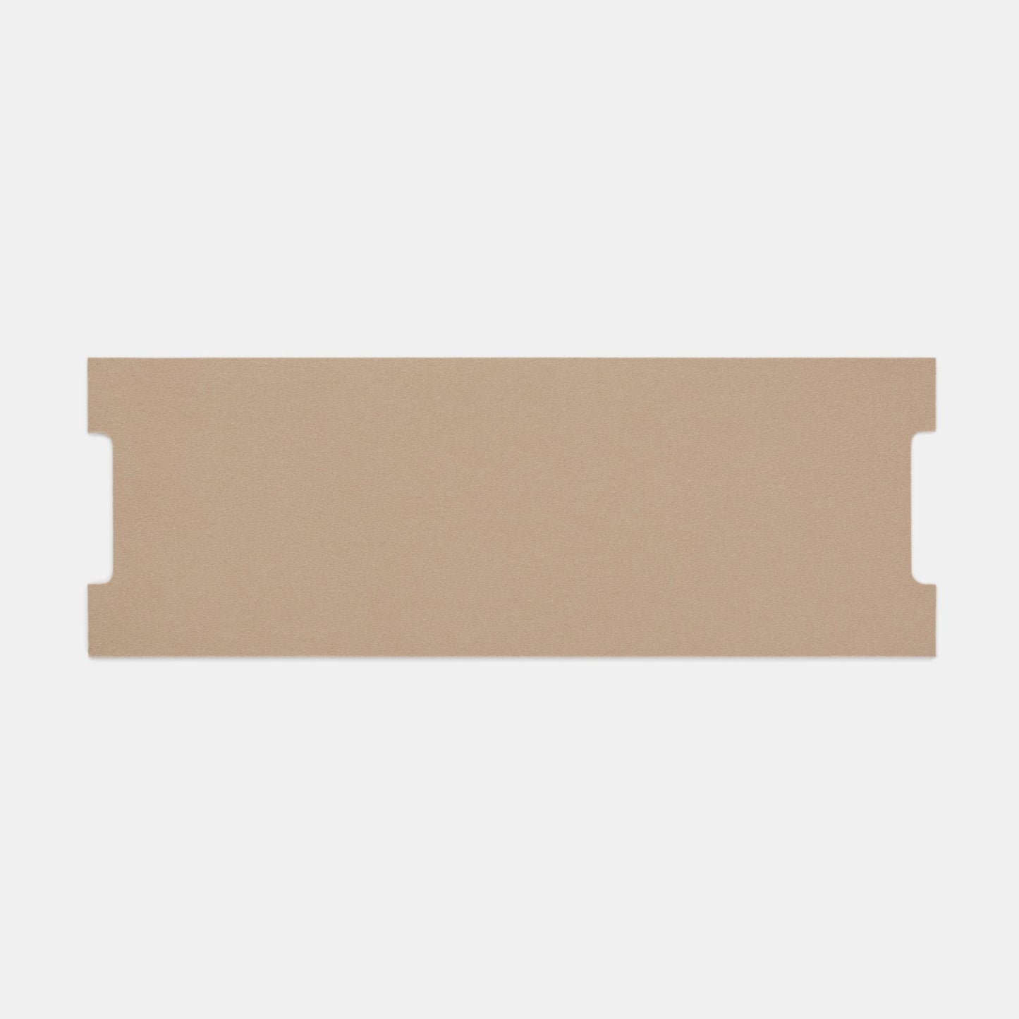 A flat, rectangular piece of light brown cardboard—Felt Tops packaging—with two small, symmetrical notches on each short side, displayed on a white background.