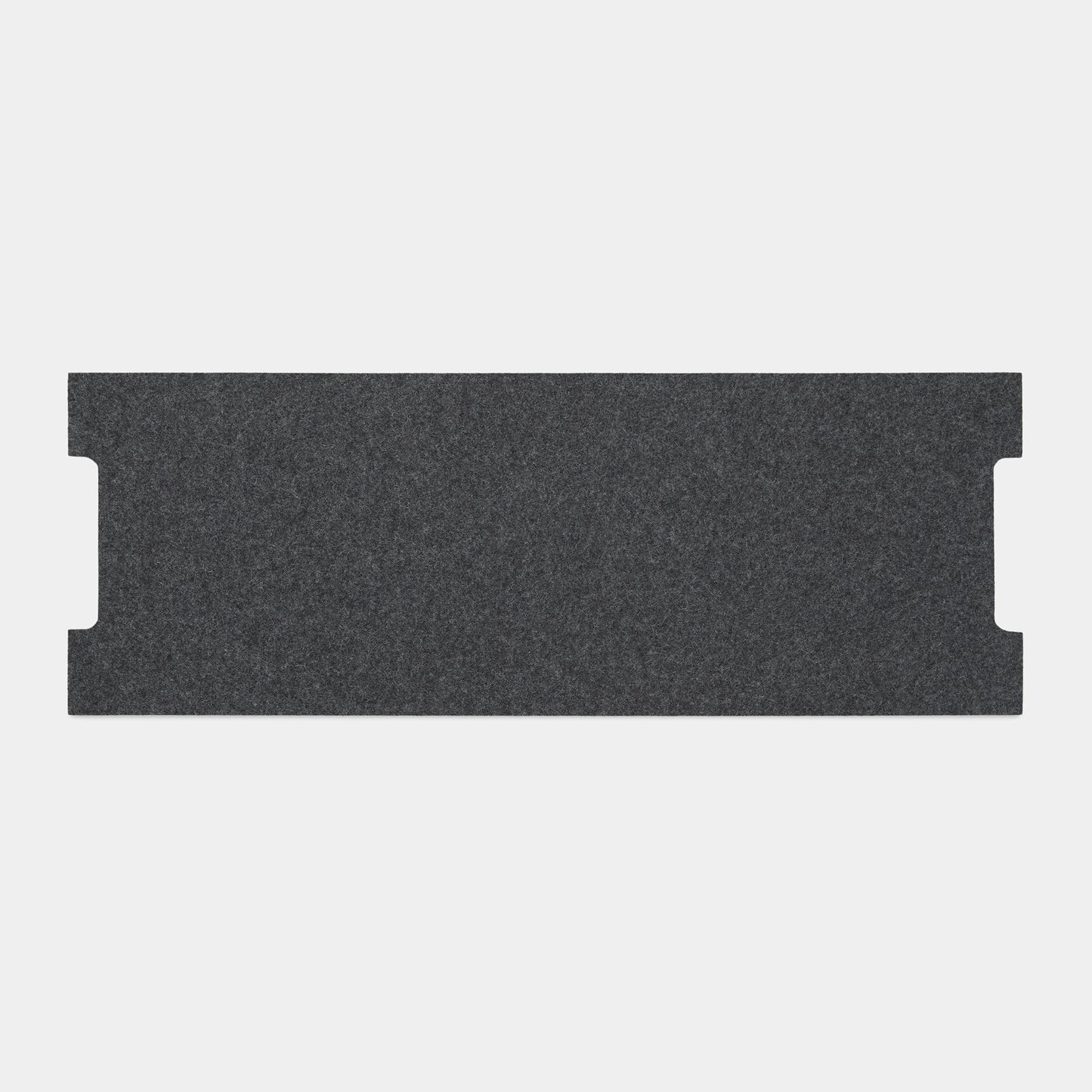 The Felt Tops is a rectangular, dark gray felt panel with two small notches on each short edge, displayed against a plain light gray background.