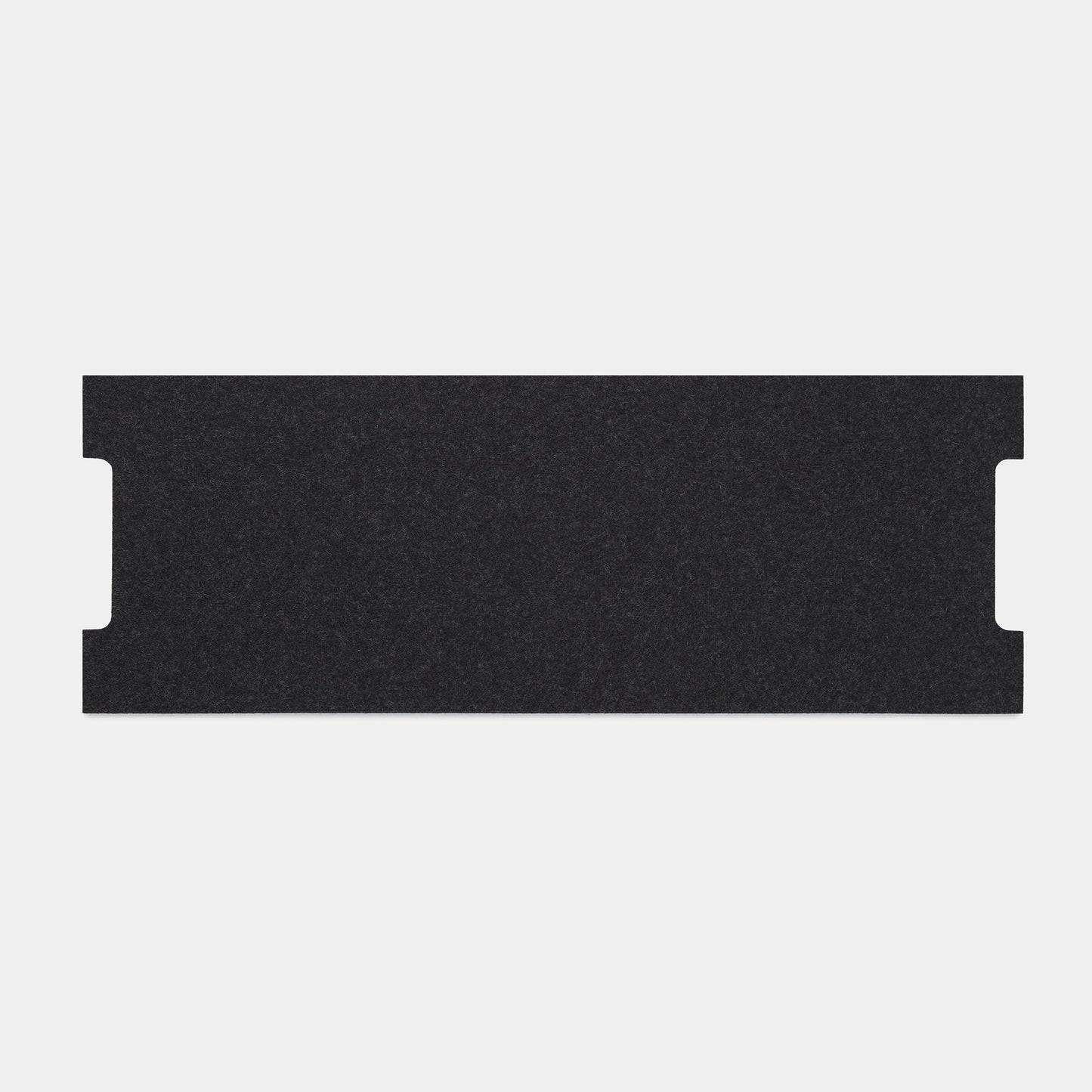 A rectangular, flat black Felt Tops sheet with two small notches on opposite shorter edges is displayed on a plain light gray background.