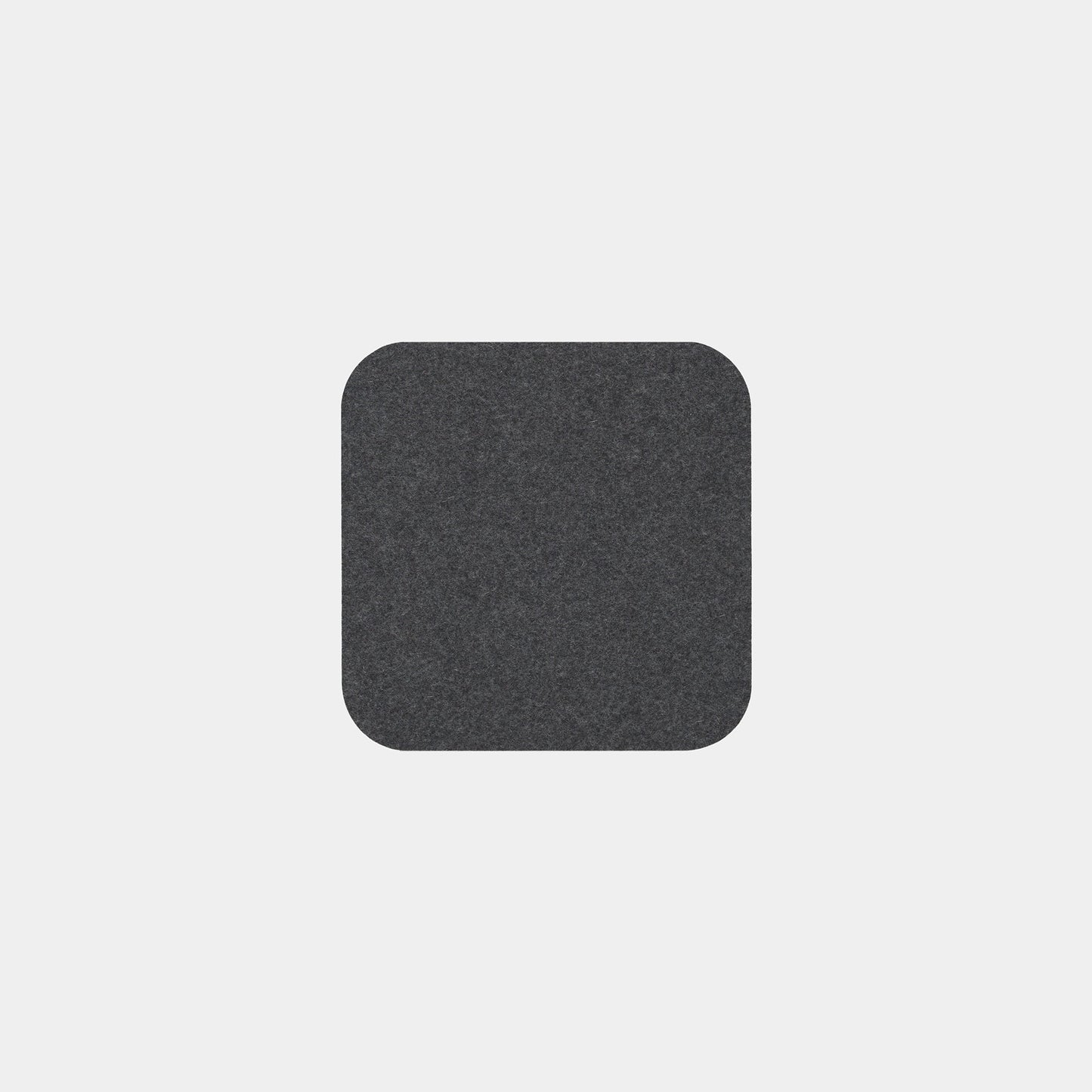 A single Felt Tops dark gray, square felt pad with rounded corners is centered on a plain light gray background.