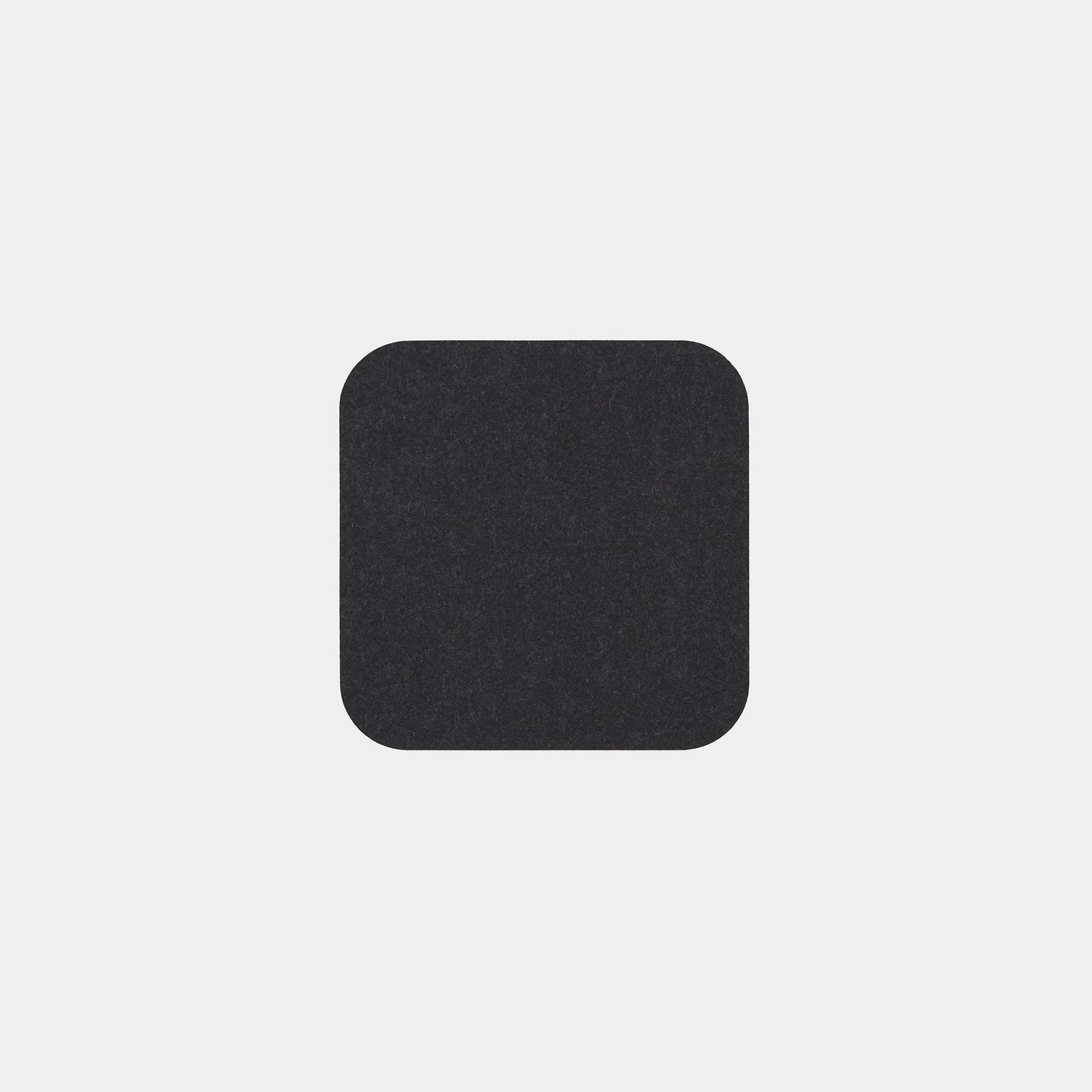 A plain, black square with rounded corners, representing the Felt Tops product, is centered on a light gray background.