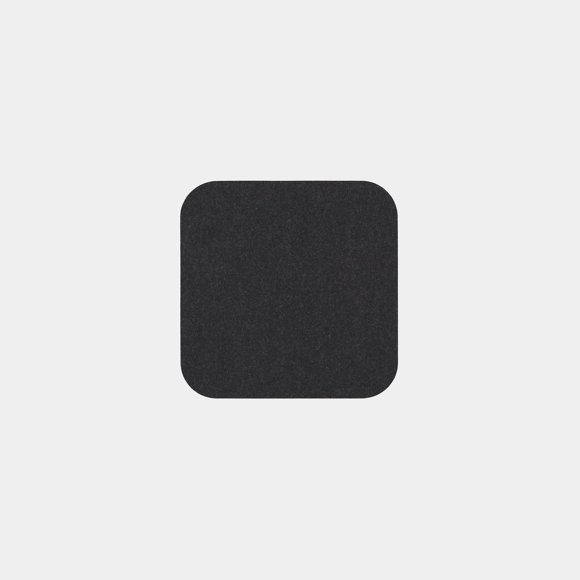 A single Felt Tops black square with rounded corners is centered on a light gray background.
