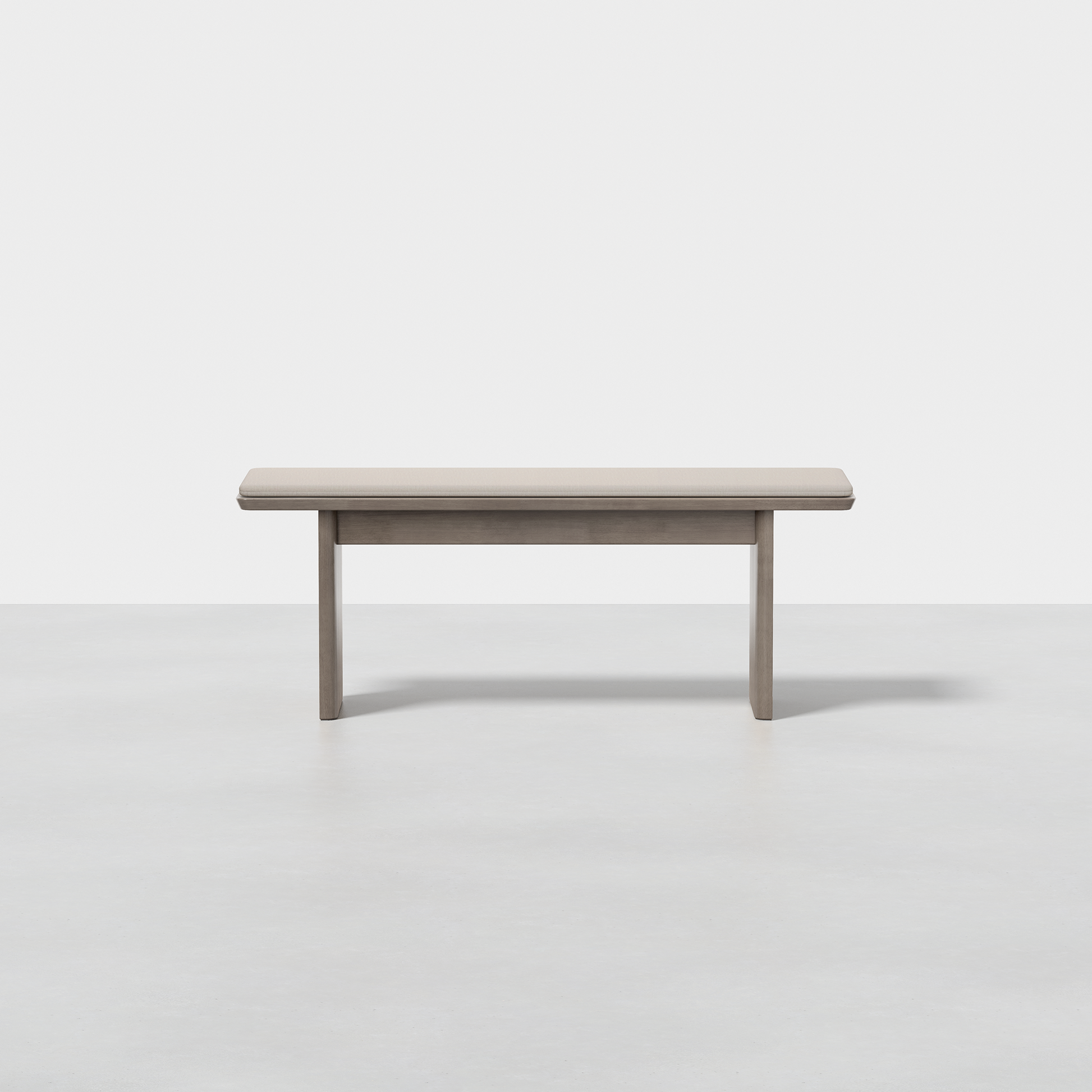 The Pillar Bench features a simple, rectangular wooden design with clean lines and a light gray finish, shown against a plain white background.