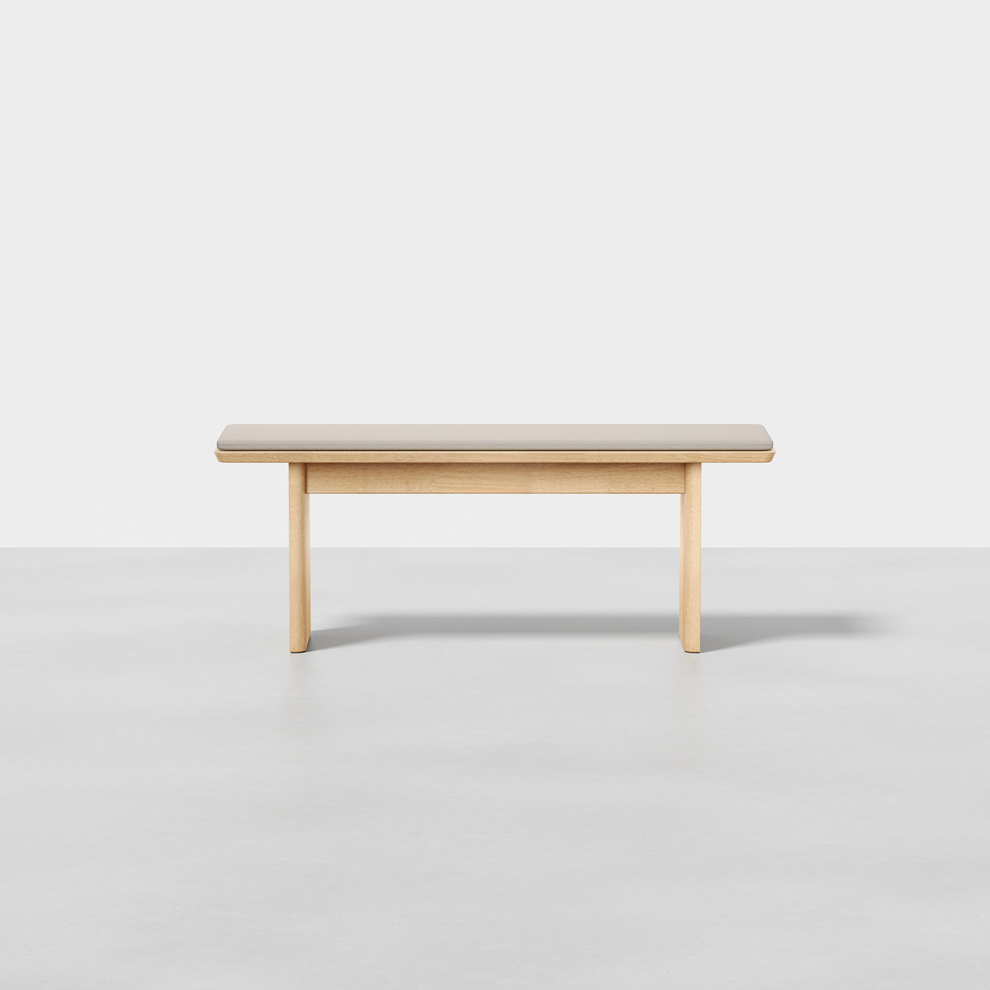 The Pillar Bench is a minimalist wooden bench featuring a flat seat and four straight legs, displayed against a plain white background.