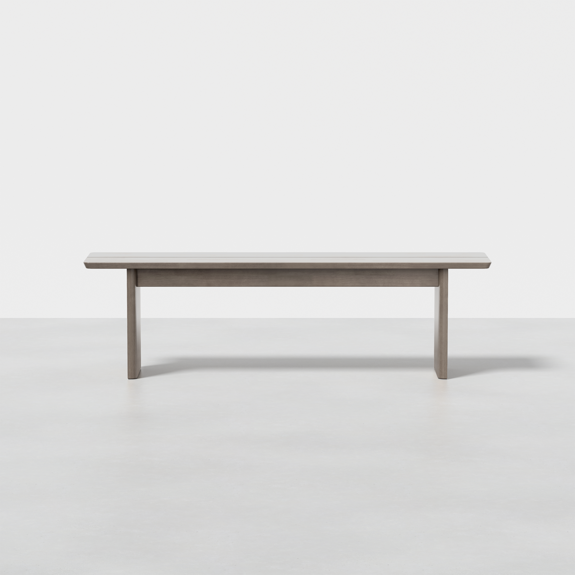 The Pillar Bench is a simple, modern wooden bench featuring a flat seat and four straight legs, shown against a plain white background.