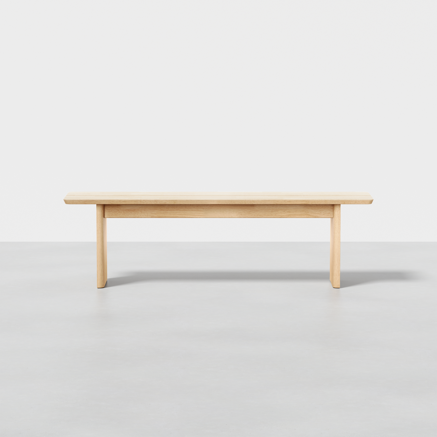 The Pillar Bench features a flat wooden seat and four straight legs, shown against a plain white background on a grey floor.