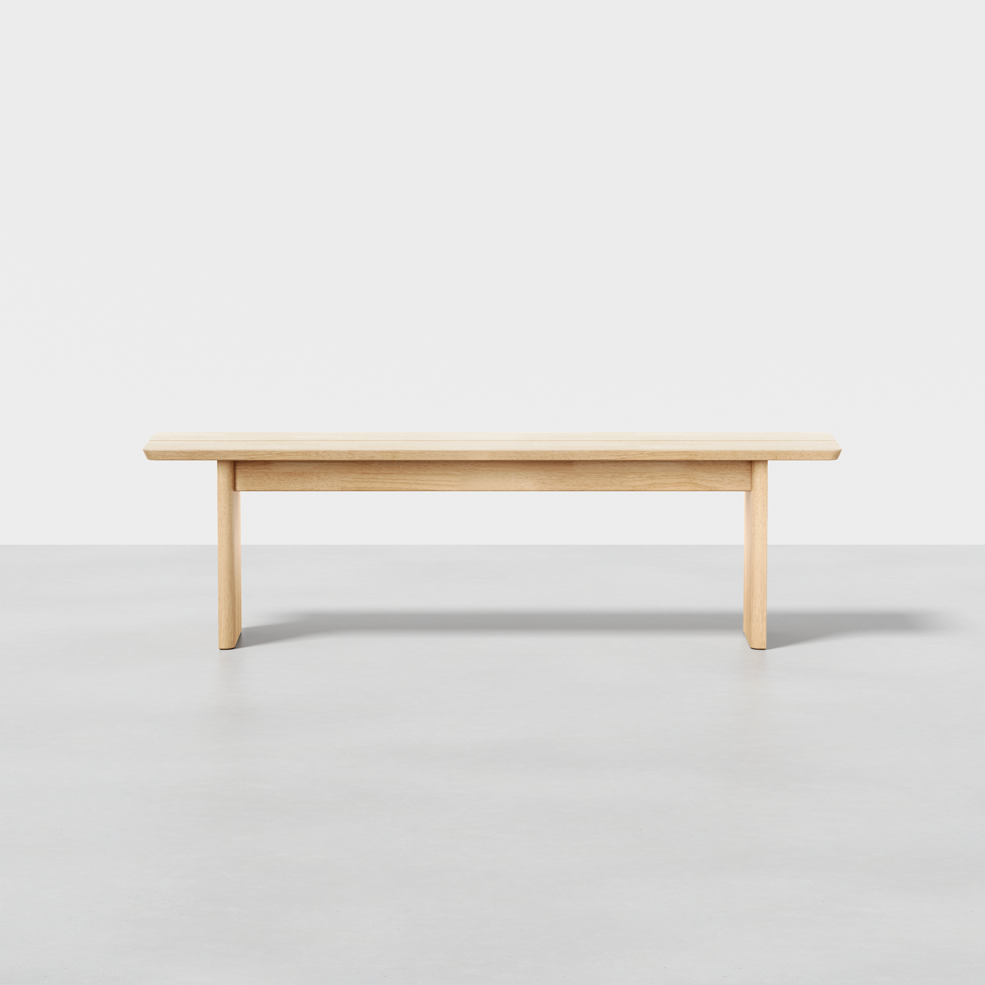 The Pillar Bench features a flat wooden seat and four straight legs, shown against a plain white background on a grey floor.