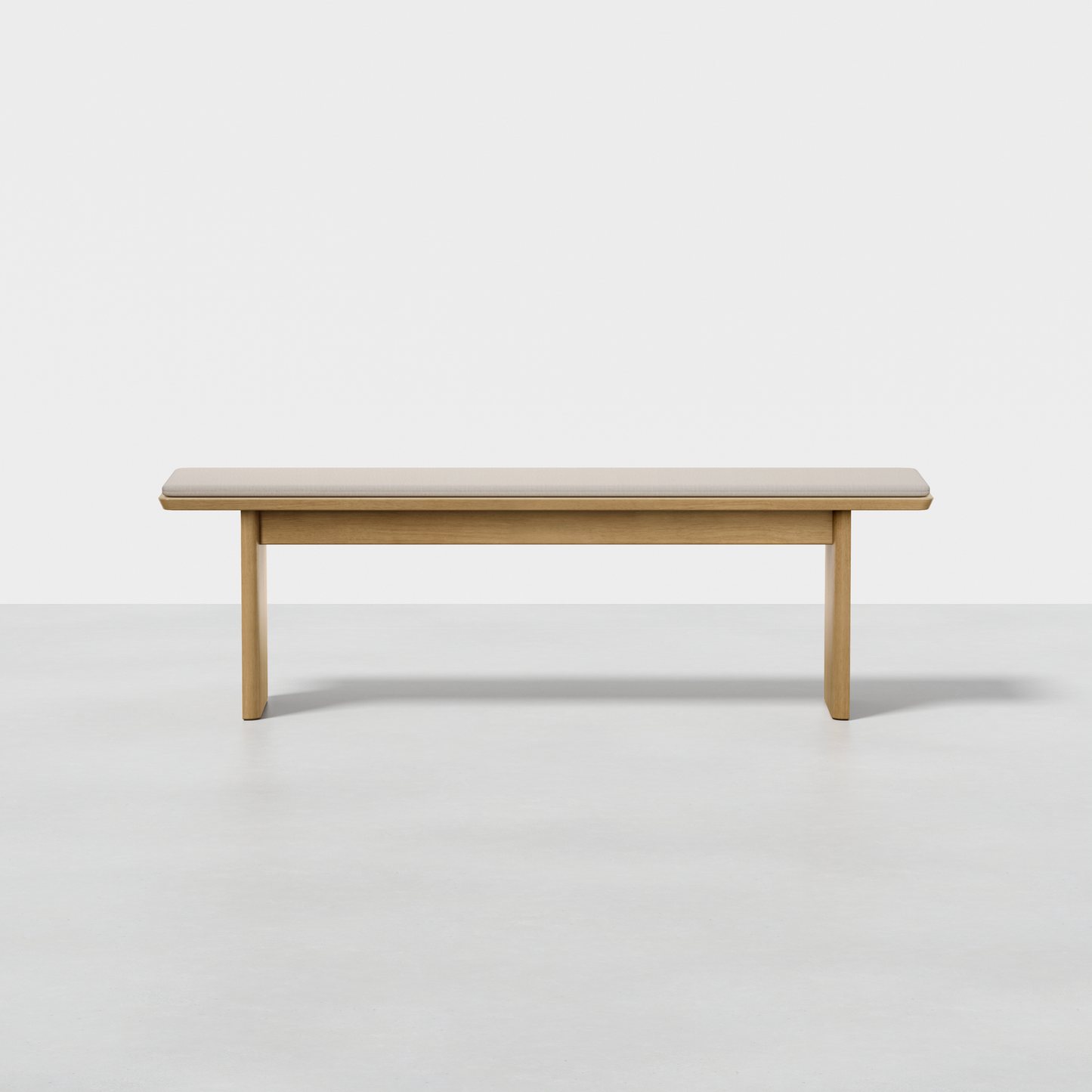 The Pillar Bench is a simple, rectangular wooden bench featuring clean lines and a light wood finish, shown against a plain white background.