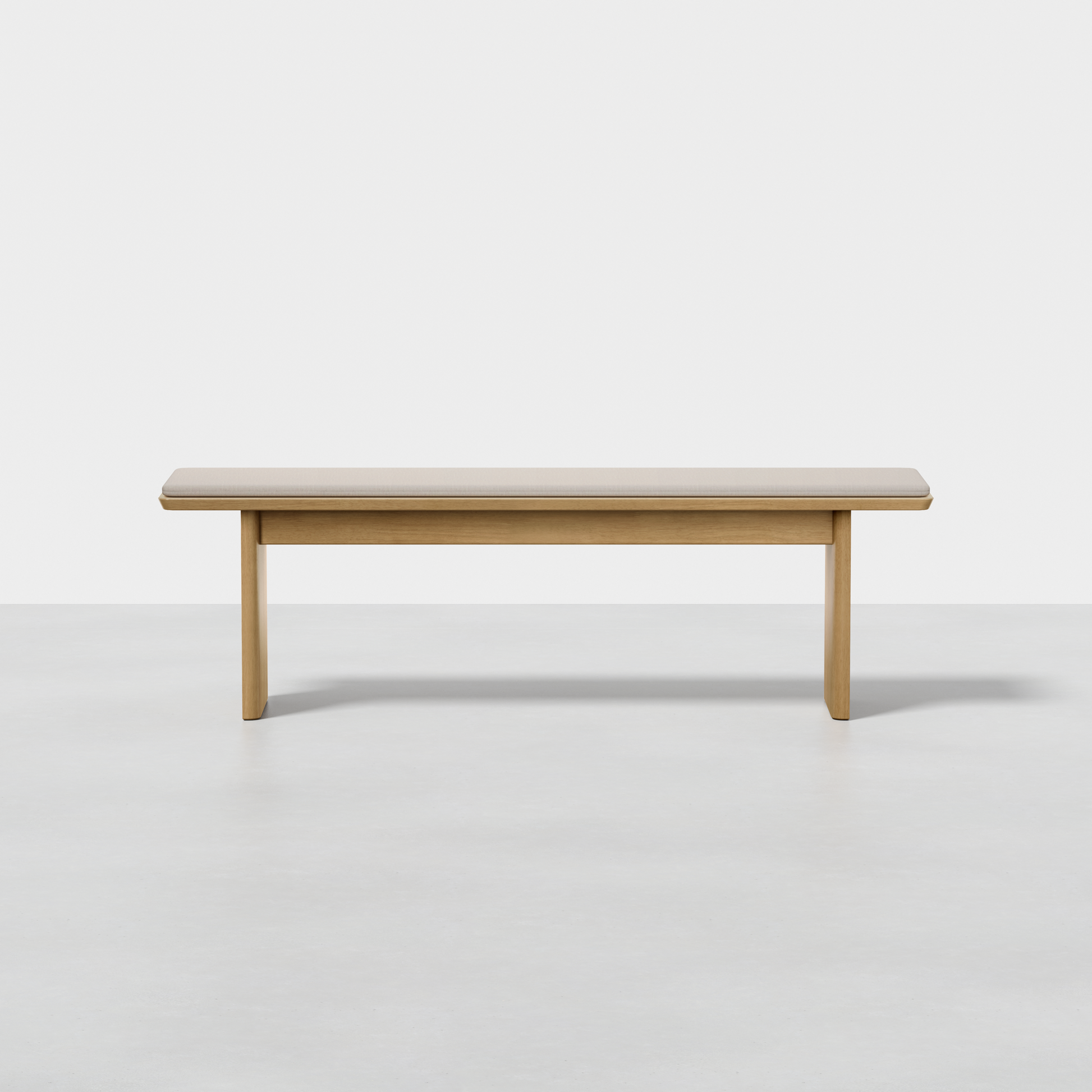 The Pillar Bench is a simple, rectangular wooden bench featuring clean lines and a light wood finish, shown against a plain white background.