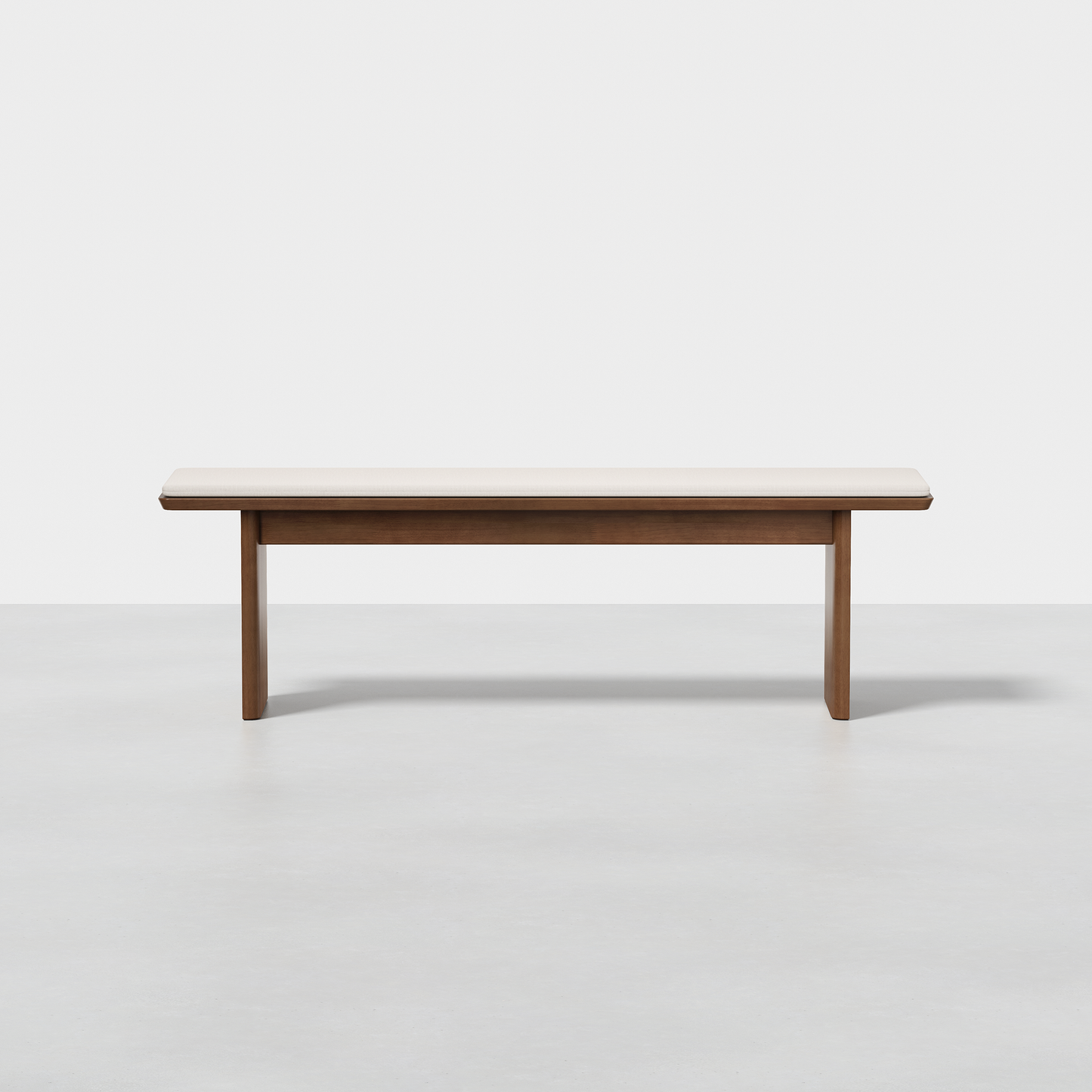 The Pillar Bench features a minimalist design with a light wooden seat and simple straight legs, shown against a plain white background.