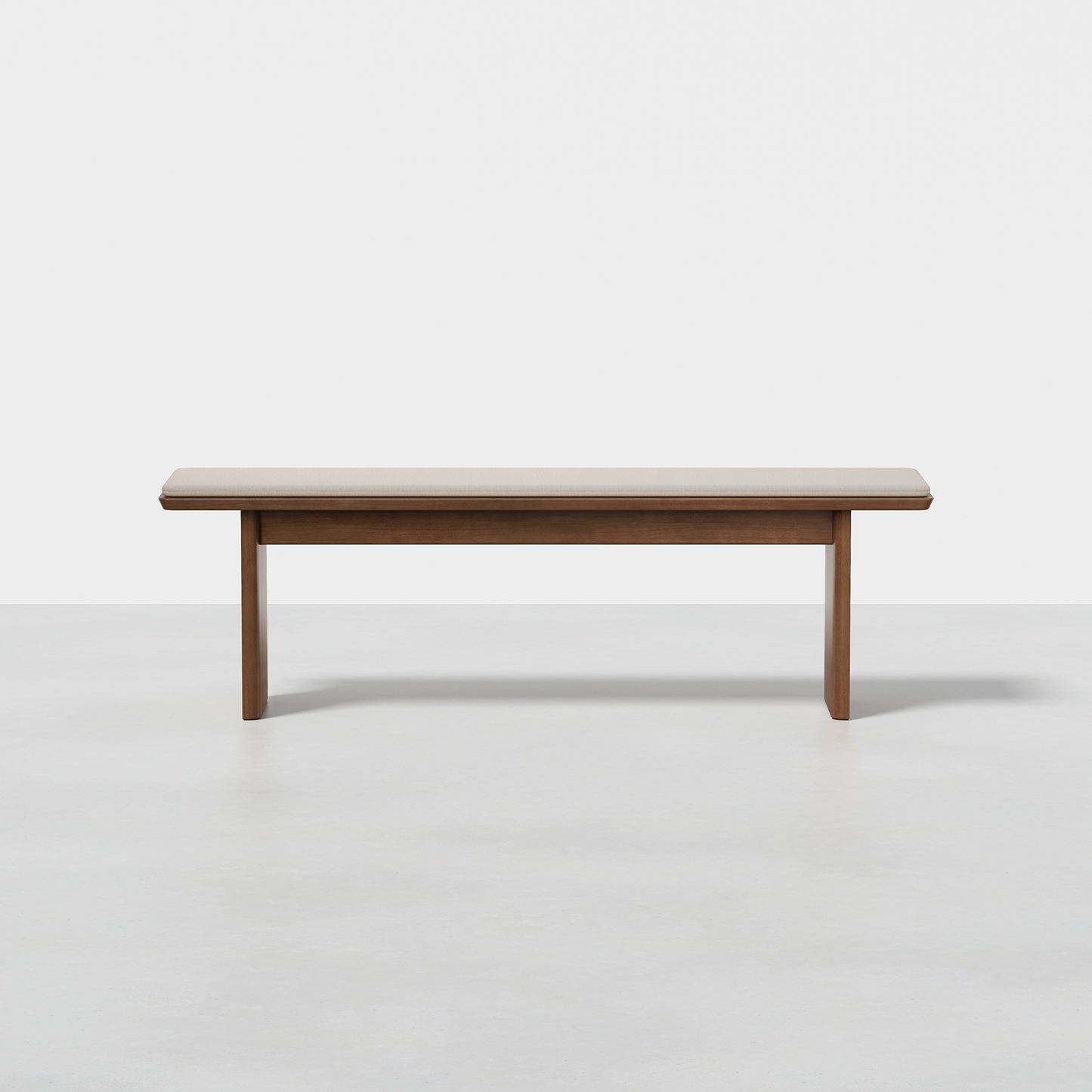 The Pillar Bench features a simple rectangular wooden seat with straight legs, shown on a light gray floor against a plain white background.